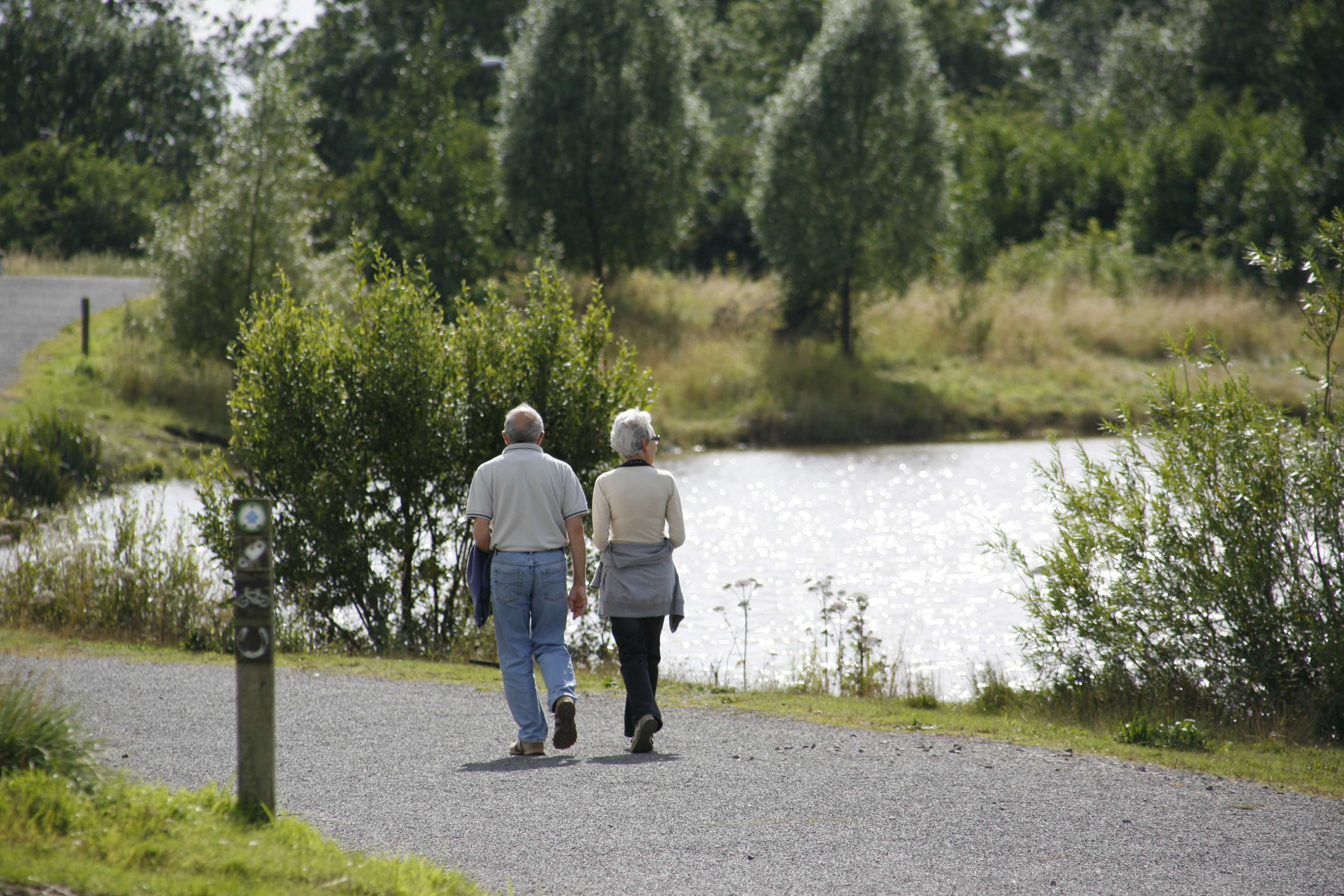Couple walking by a lake